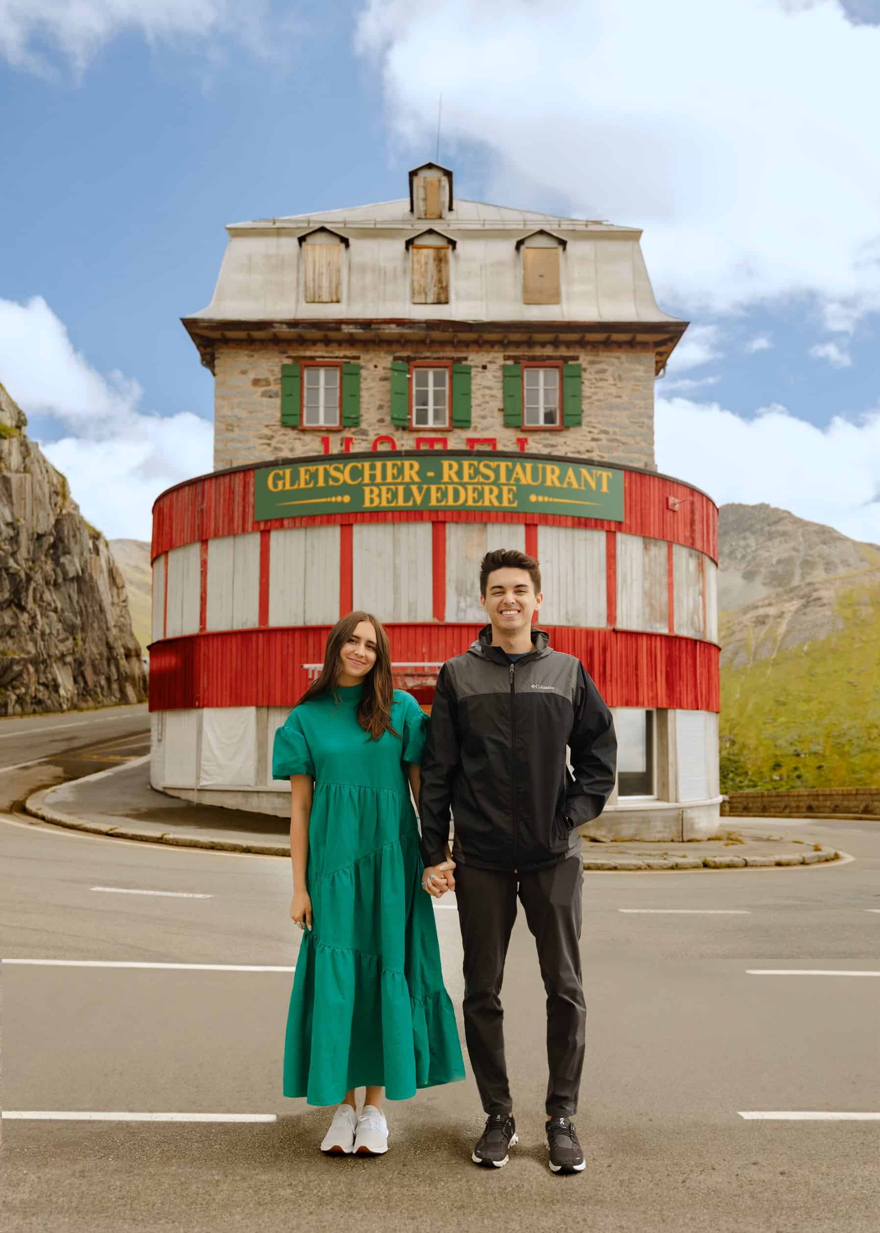 Utah Videography Couple in front of restaurant in Switzerland