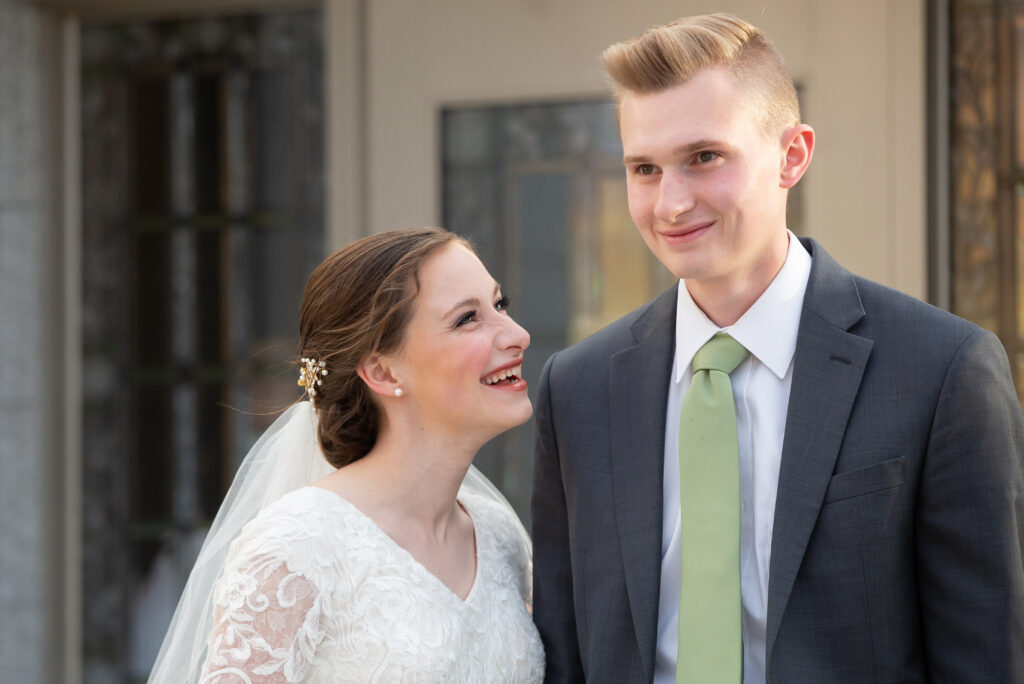 bride smiling up at groom